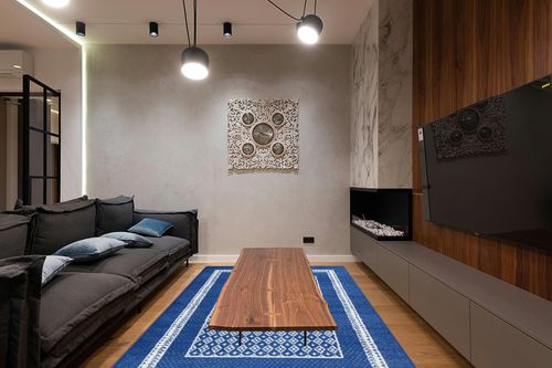 HomeRoots 6' X 9' Navy Blue Geometric Dhurrie Area Rug in Dark Wood Living Room with Black Couch