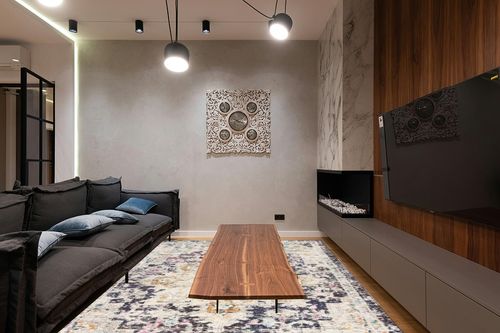 SAFAVIEH Madison Collection Area Rug - 8' x 10', Black & Gold, Boho Chic Medallion Distressed Design, Non-Shedding & Easy Care, Ideal for High Traffic Areas in Living Room, Bedroom (MAD473Z) in Dark Wood Living Room with Black Couch