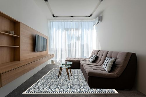 SAFAVIEH Cambridge Collection Area Rug - 8' x 10', Navy Blue & Ivory, Handmade Moroccan Wool, Ideal for High Traffic Areas in Living Room, Bedroom (CAM123G) in Grey Living Room with Brown Couch