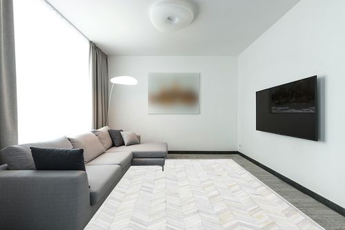 Handmade Cowhide Contemporary Ivory Area Rug 9 x 12 in Modern Living Room with Grey Couch