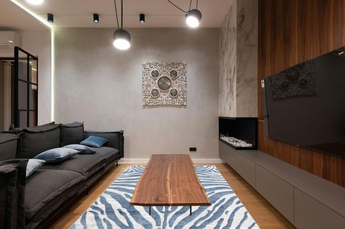 Abani Nova NOV170A Blue Grey Zebra Print Area Rug 6' x 9' in Dark Wood Living Room with Black Couch