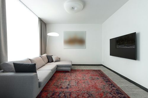 NEATIIP Bohemian Machine Washable 8x10 Area Rugs for Living Room, Non Slip Boho Soft Dorm Rug, Low Pile Dining Office Mat Non-Shedding Indoor Carpet for Bedroom Orange Red/Yellow in Modern Living Room with Grey Couch