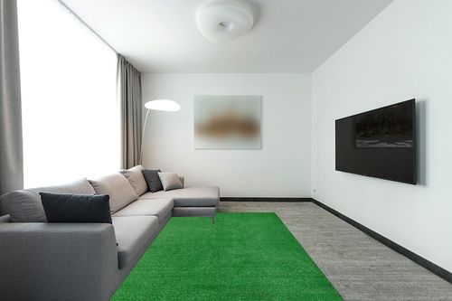 Garland Rug Artificial Grass 6 ft. x 9 ft. Large Indoor/Outdoor Area Rug Green in Modern Living Room with Grey Couch