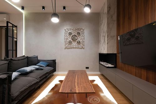 Genuine Brown Cowhide Rug 6 x 7-8 ft. 180 x 220 cm in Dark Wood Living Room with Black Couch