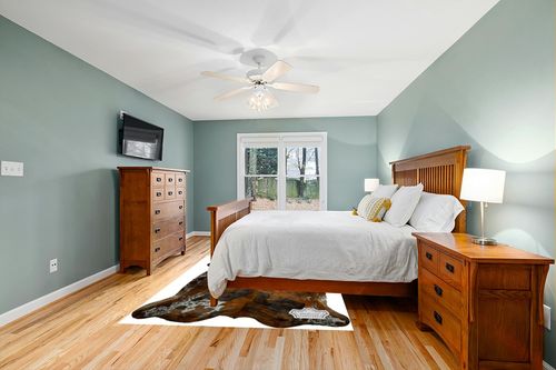 Appaloosa Cowhides Natural Cowhide Rug - Tricolor Cowhide Area Rug for Bedroom & Living Room - Luxury Cowhides Modern Accent Rug - Genuine Leather with Real Animal Fur, Medium, 6 x 8 Feet in Teal and Orange Wood Bedroom