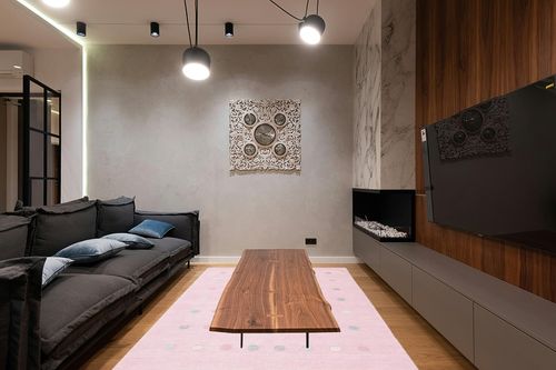 SAFAVIEH Kids Collection Area Rug - 6' x 9', Light Pink, Handmade Polka Dot Wool, Ideal for High Traffic Areas in Living Room, Bedroom (SFK803U) in Dark Wood Living Room with Black Couch