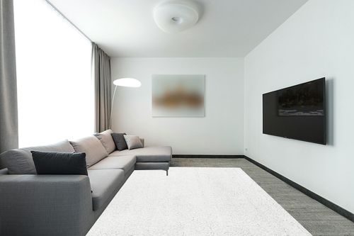 White 8x10  Shag Rug in Modern Living Room with Grey Couch