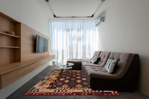 SAFAVIEH Aspen Collection Area Rug - 8' x 10', Red & Yellow, Handmade Boho Tribal Southwestern Wool, Ideal for High Traffic Areas in Living Room, Bedroom (APN404Q) in Grey Living Room with Brown Couch