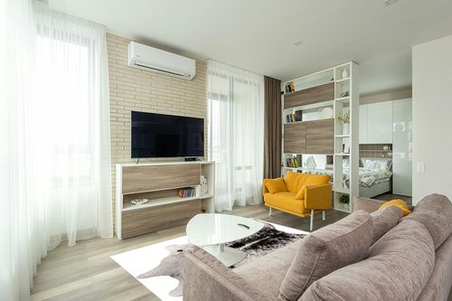 Cowhide Area Rug in Light Modern Living Room with TV