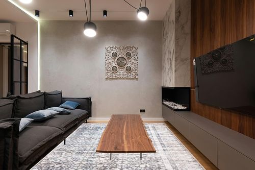 Bloom Rugs Washable Non-Slip 9' x 12' Rug - Tan/Blue/Green Traditional Area Rug for Living Room, Bedroom, Dining Room, and Kitchen - Exact Size: 9' x 12' in Dark Wood Living Room with Black Couch