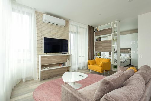 JONATHAN Y SEU100P-6OV Haze Solid Low-Pile Indoor Area Rug, Coastal, Bohemian, Minimalist, Classic, Casual for Bedroom,Kitchen,Living Room,Non Shedding,Easy-Washing, Pink, 6 X 9 Oval in Light Modern Living Room with TV