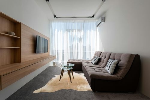 Sunshine Cowhides Genuine Palomino Beige Cowhide Rug - Luxurious Cow Rug for Bedroom, Living Room, and Home Decor Enthusiasts - Masterpiece of Style and Functionality - XL 6x7-8ft (180x240cm) in Grey Living Room with Brown Couch