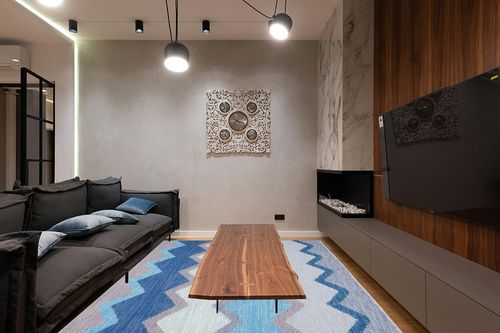 Dash & Albert Safety Net Handwoven Indoor/Outdoor Rug, 8 X 10 Feet, Blue/Grey Geometric Pattern in Dark Wood Living Room with Black Couch