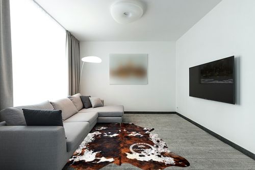 Prime Cowhides Cowhide Rug Tricolor Genuine Hair on Hide Size: Medium (5ft x 6ft) (150cm x 180cm) in Modern Living Room with Grey Couch