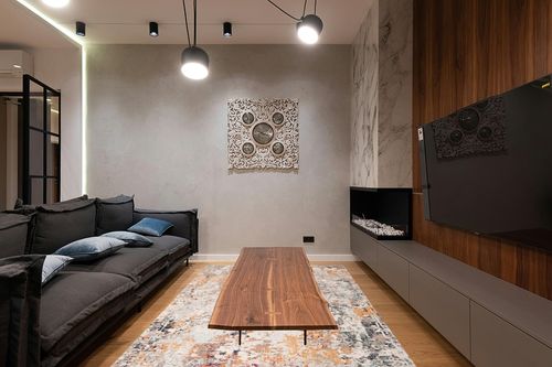 SAFAVIEH Madison Collection Area Rug - 6' x 9', Grey & Beige, Modern Abstract Design, Non-Shedding & Easy Care, Ideal for High Traffic Areas in Living Room, Bedroom (MAD453A) in Dark Wood Living Room with Black Couch