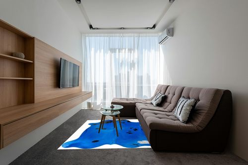 Appaloosa Cowhides Color Dyed Collection (Vibrant Blue) in Grey Living Room with Brown Couch