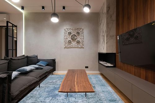 SAFAVIEH Tucson Collection Area Rug - 9' x 12', Green & Green, Persian Design, Non-Shedding Machine Washable & Slip Resistant Ideal for High Traffic Areas in Living Room, Bedroom (TSN190X) in Dark Wood Living Room with Black Couch