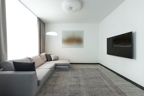 SAFAVIEH Abstract Collection Area Rug - 8' x 10', Ivory & Charcoal, Handmade Wool, Ideal for High Traffic Areas in Living Room, Bedroom (ABT340H) in Modern Living Room with Grey Couch