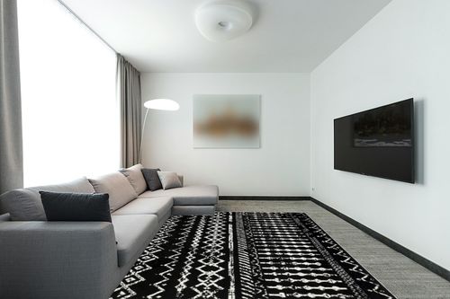 Antep Rugs Bohemian 8x10 Geometric Indoor Area Rug Phoenix, 7'10" x 10', Black in Modern Living Room with Grey Couch