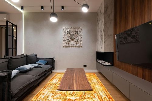 Unique Loom Sofia Collection Area Rug - Salle Garnier (6' 1" x 9' Rectangle, Orange/ Yellow) in Dark Wood Living Room with Black Couch