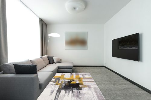 Gold Modern Stain Resistant Living Room Area Rug in Modern Living Room with Grey Couch