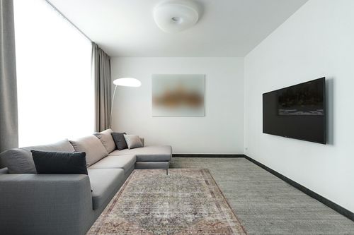 Loloi Amber Lewis x Loloi Georgie Collection GER-04 Teal/Antique 5'-0" x 7'-6" Area Rug in Modern Living Room with Grey Couch