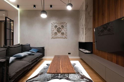Sunshine Cowhides Genuine Salt and Pepper Longhorn Tricolor Cowhide Rug - Luxurious Cow Rug for Bedroom, Living Room, and Home Decor Enthusiasts - Stylish Masterpiece - 6x7ft (180x210cm) in Dark Wood Living Room with Black Couch