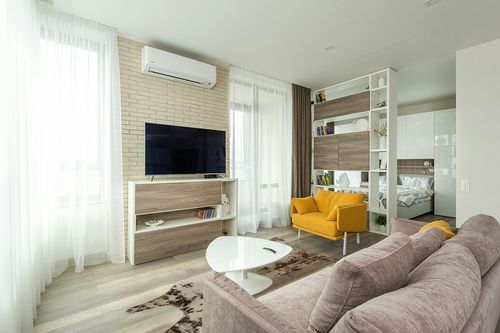 nuLOOM Marcia Machine Washable Faux Cowhide Area Rug, 5' 9" x 7' 7", Brown in Light Modern Living Room with TV