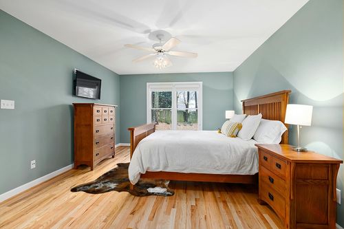 Appaloosa Cowhides Natural Cowhide Rug - Tricolor Cowhide Area Rug for Bedroom & Living Room - Luxury Cowhides Modern Accent Rug - Genuine Leather with Real Animal Fur, Medium, 5 x 7 Feet in Teal and Orange Wood Bedroom