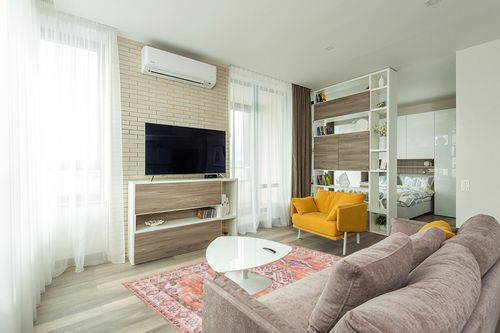 vivorug Washable Rug, Ultra Soft Area Rug 5x7, Non Slip Boho Rug Foldable, Stain Resistant Rugs for Living Room, Persian Tribal Medallion (Orange, 5'x7') in Light Modern Living Room with TV