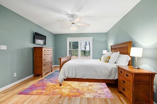 Nourison Passion Bohemian Abstract Sunburst Area Rug, (8' x 10') in Teal and Orange Wood Bedroom