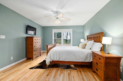 eCowhides Dark Brindle Brazilian Cowhide Area Rug, Cowskin Leather Hide for Home Living Room (XL) 7 x 6 ft in Teal and Orange Wood Bedroom