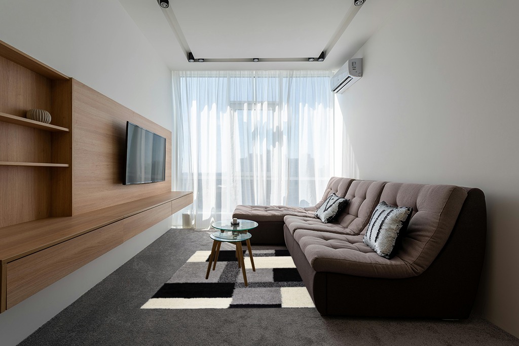 Are black rugs a bad idea in Grey Living Room with Brown Couch