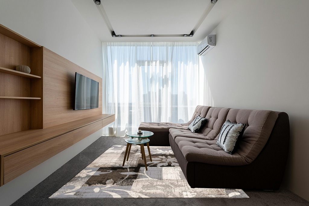 Rugs on grey carpet ideas in Grey Living Room with Brown Couch
