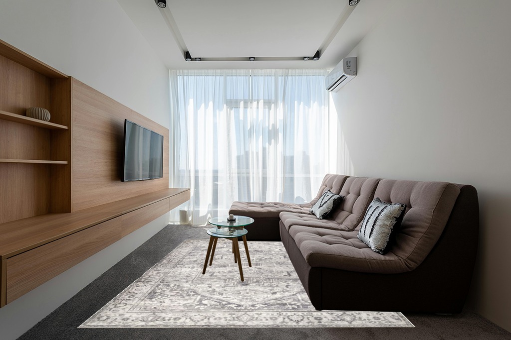 Rugs on grey carpet ideas in Grey Living Room with Brown Couch