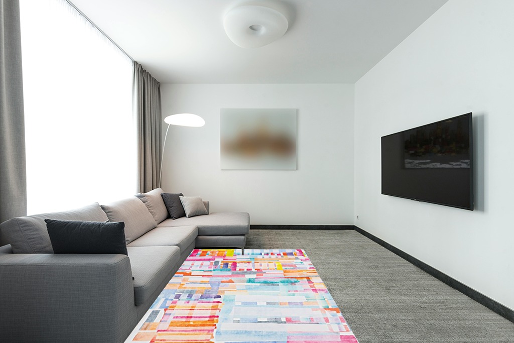 Rug over carpet ideas in Modern Living Room with Grey Couch