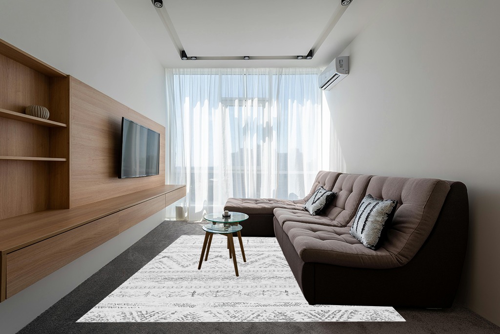 Rugs on grey carpet ideas in Grey Living Room with Brown Couch