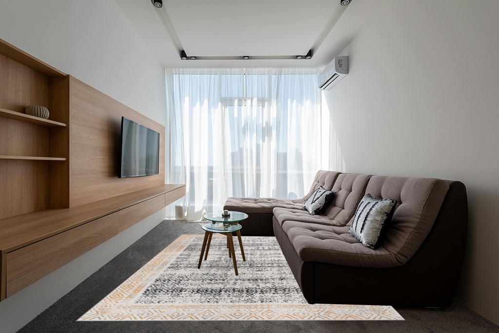 Rugs on grey carpet ideas in Grey Living Room with Brown Couch