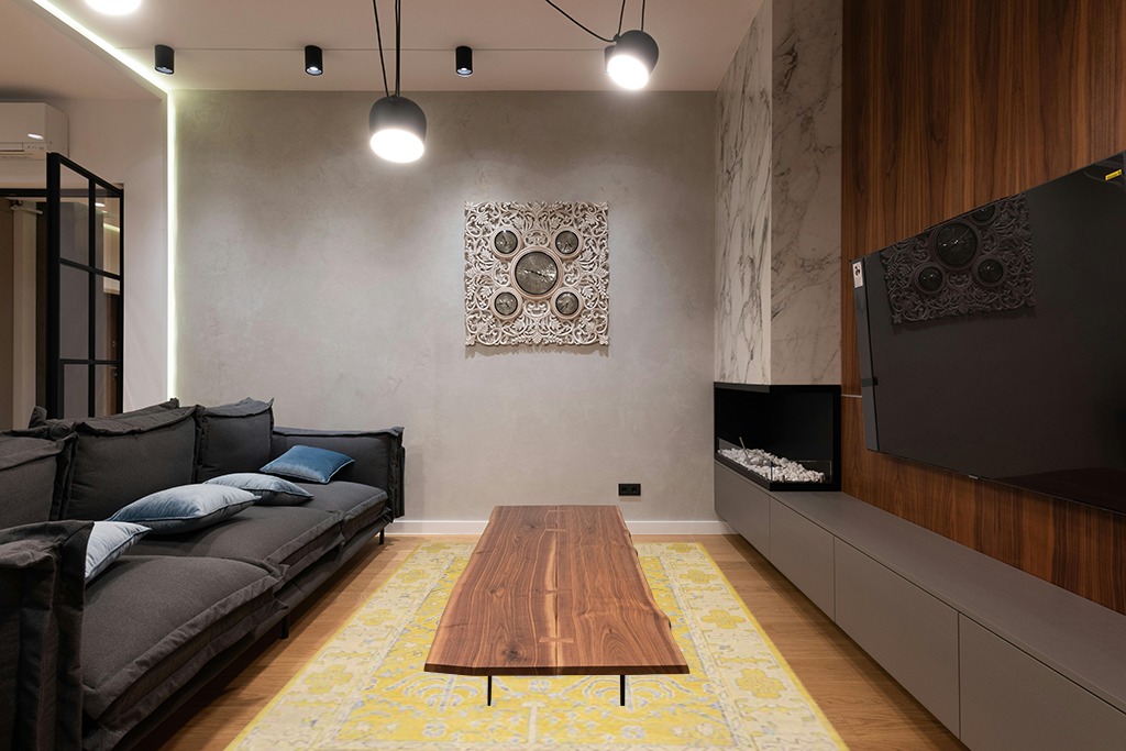 Yellow rug ideas in Dark Wood Living Room with Black Couch