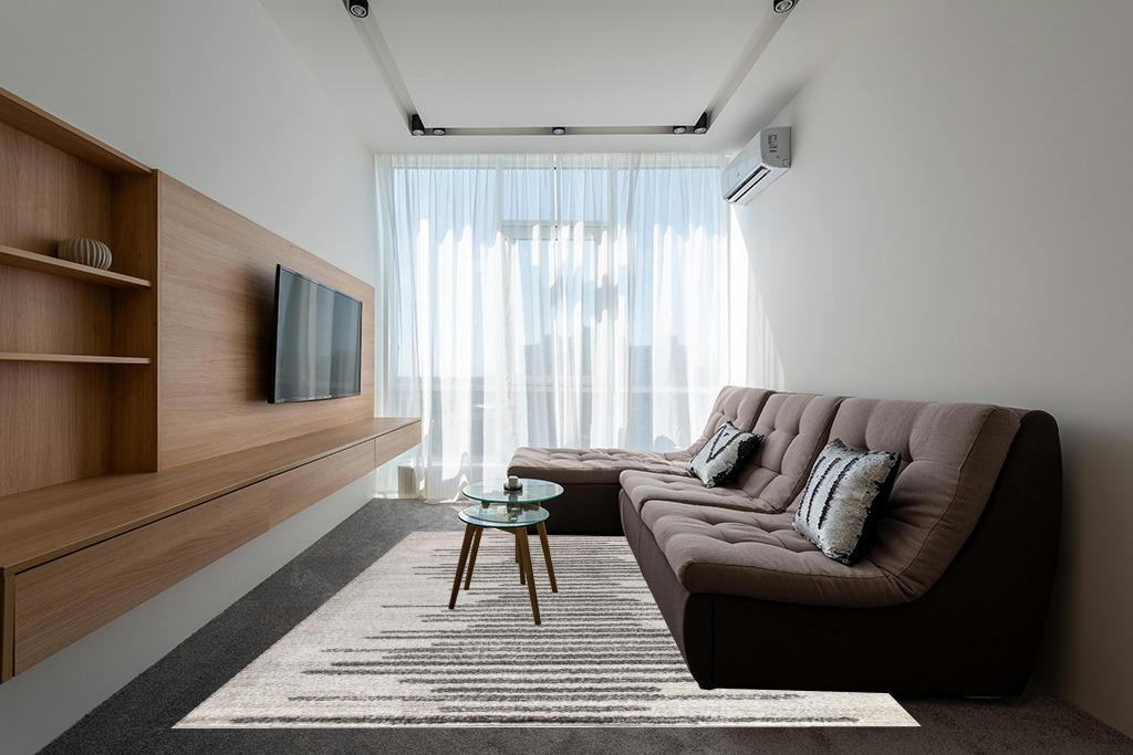 Rugs on grey carpet ideas in Grey Living Room with Brown Couch