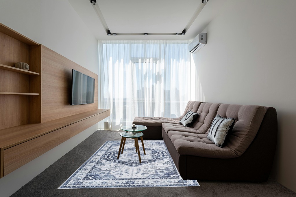Rugs on grey carpet ideas in Grey Living Room with Brown Couch