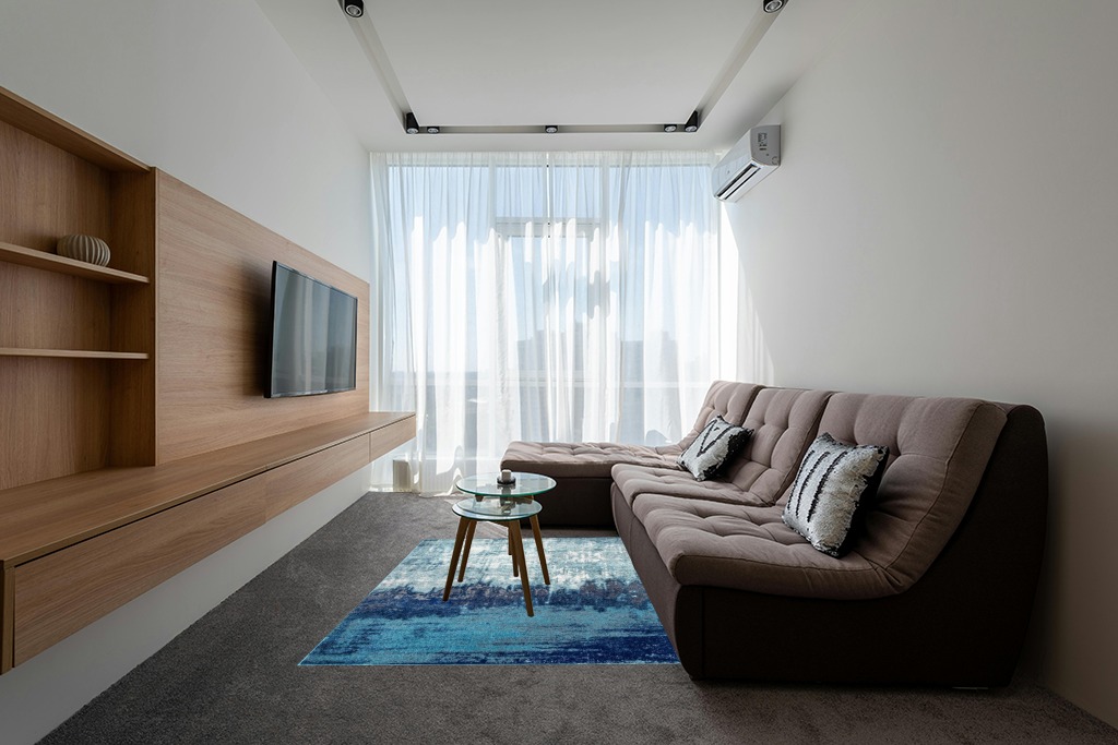 Blue rug ideas in Grey Living Room with Brown Couch
