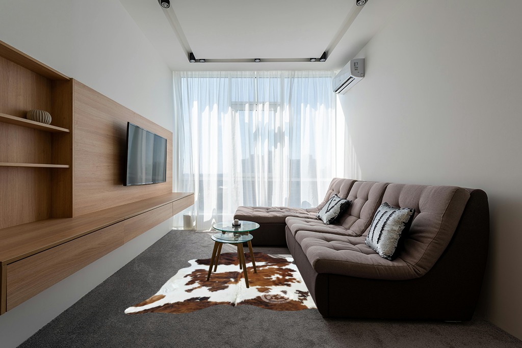 Cowhide rug decor ideas in Grey Living Room with Brown Couch