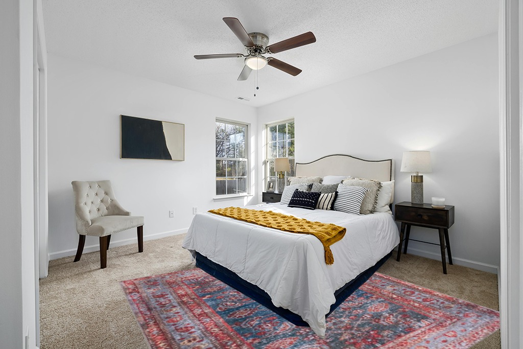 Rug on carpet bedroom ideas in White and Yellow Modern Bedroom