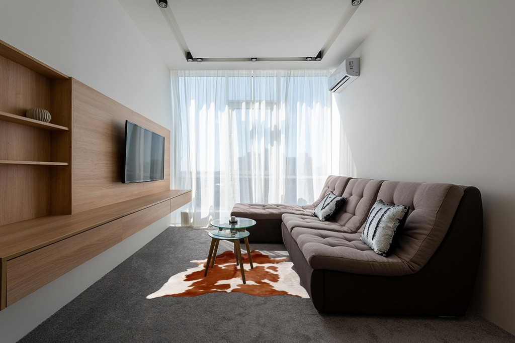 Cowhide rug decor ideas in Grey Living Room with Brown Couch