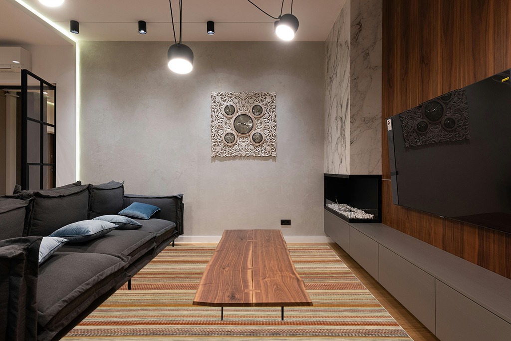 Cute rug ideas in Dark Wood Living Room with Black Couch