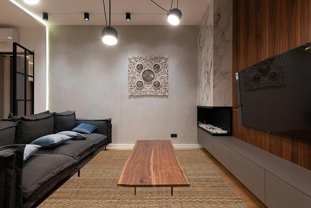 Living room ideas persian rug in Dark Wood Living Room with Black Couch