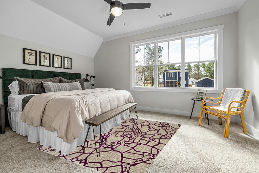 Rug on carpet bedroom ideas in Grey Traditional Bedroom with King Bed
