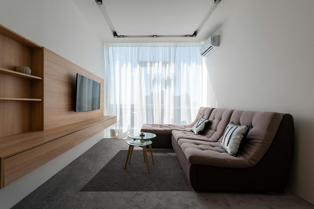 Rugs on grey carpet ideas in Grey Living Room with Brown Couch