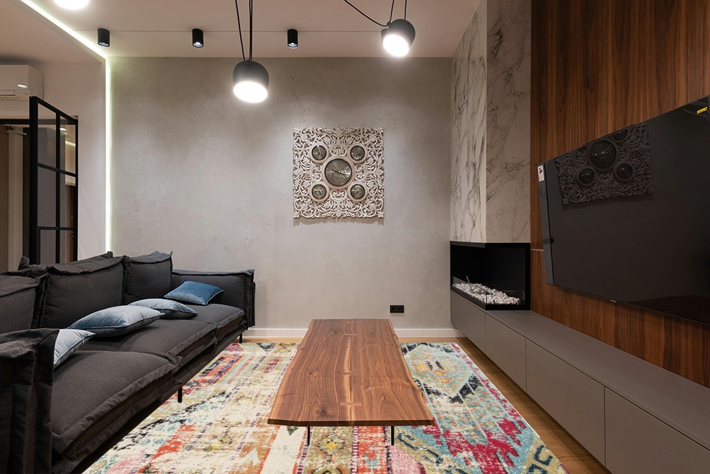 Green rug ideas in Dark Wood Living Room with Black Couch